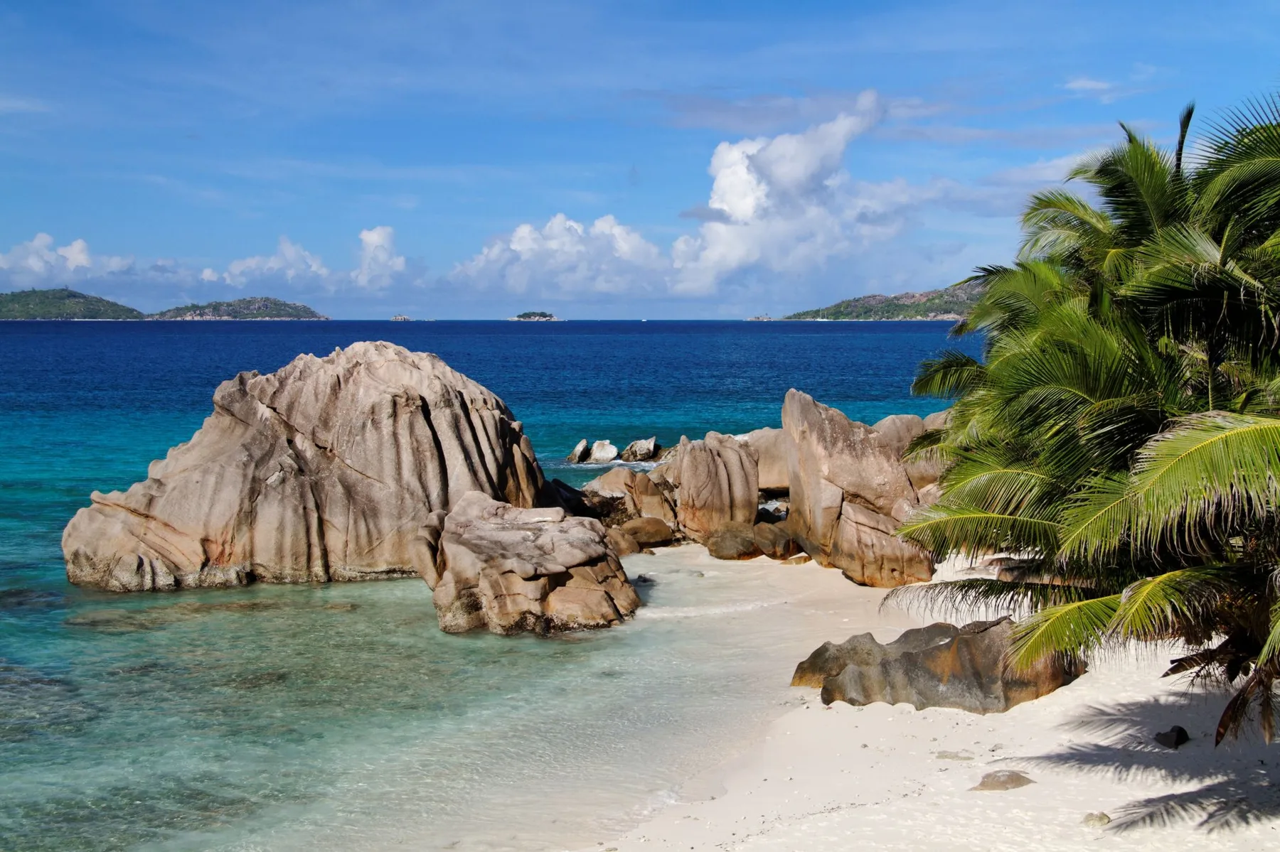 Clear turquoise water around coastal granite in Seychelles